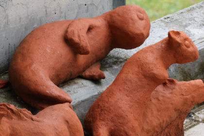 Thumbnail of two clay otter sculptures, from a Canon CR3 RAW file