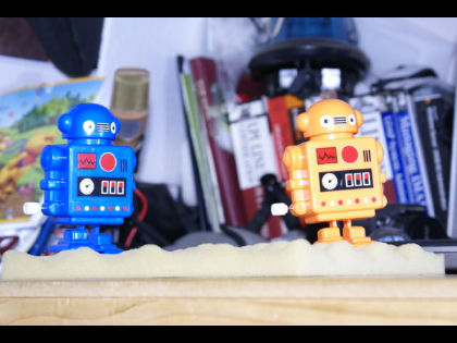 Thumbnail of two toy robots, one blue and one orange, from a Sony ARW RAW file